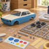 車の模型とランナー、ニッパー、ヤスリ、筆を並べた工作机のイラスト